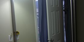 Kids bathroom with a framed mirror.