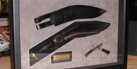 Knife in a shadow box frame.