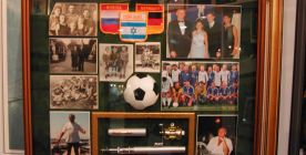 Family memories in a deep shadow box frame.