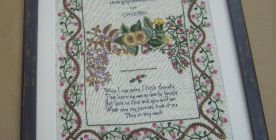 Needlepoint matted and framed.